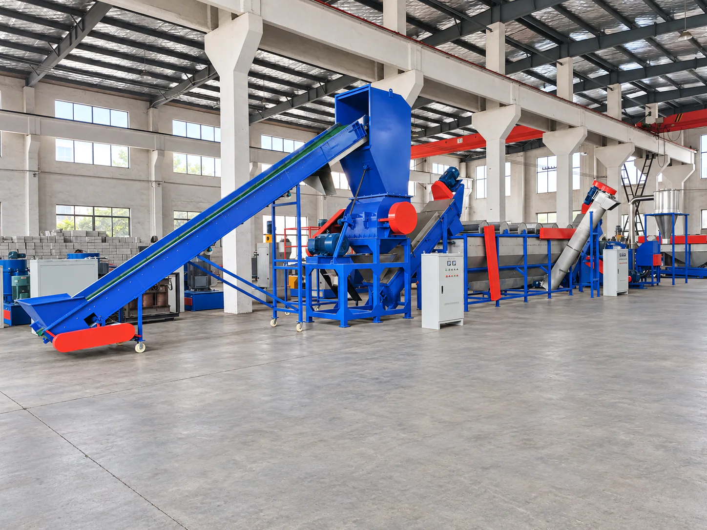 Blue plastic recycling line assembled inside the Kailong Machinery workshop